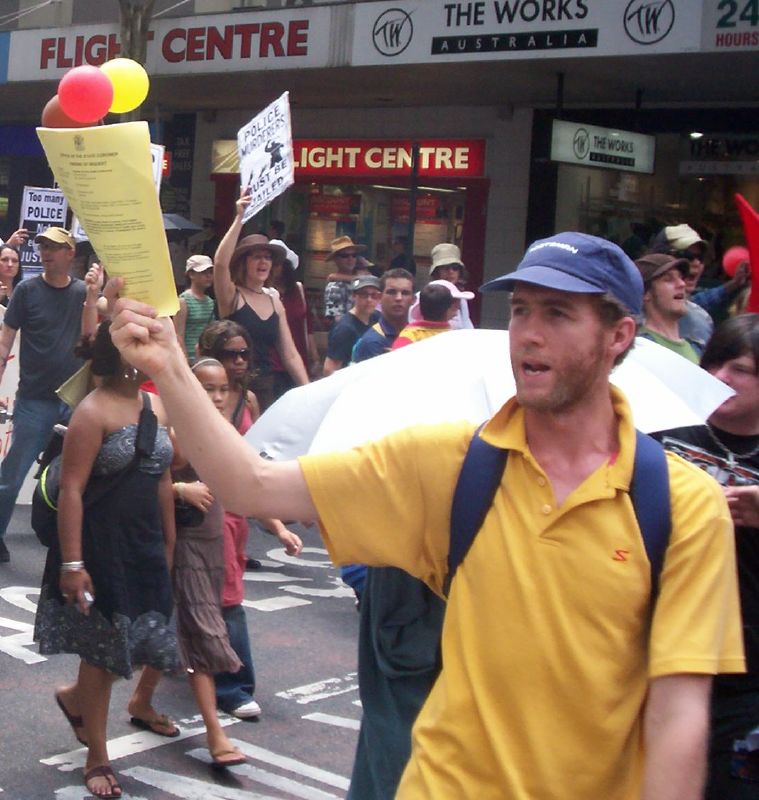 Body of the march passes through the Adelaide St and Edward St intersection, turning right into Edward St-1 - Justice for Mulrunji Rally at Queens Park and March through Brisbane City, Australia, November 18 2006