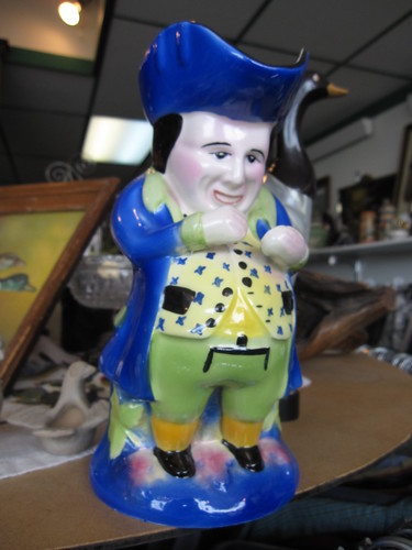 odd little pot bellied man pitcher