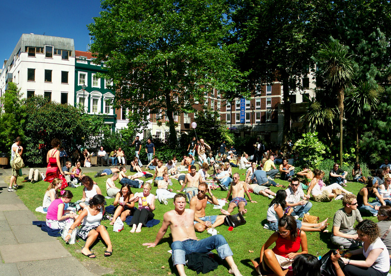 Soho Square in London filled with people