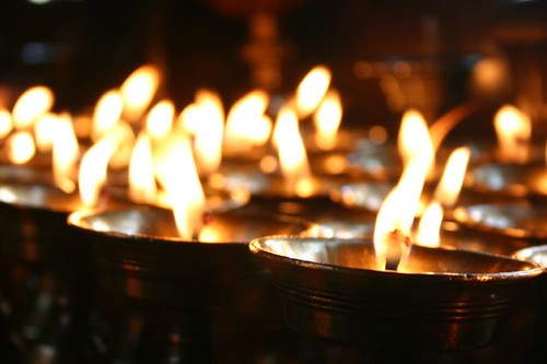 Candles inside a monastery at the Swayambunath Temple, Kathmandu