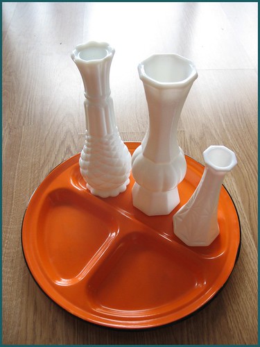 milk glass vases and orange metal tray