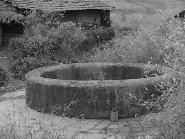 House by the well