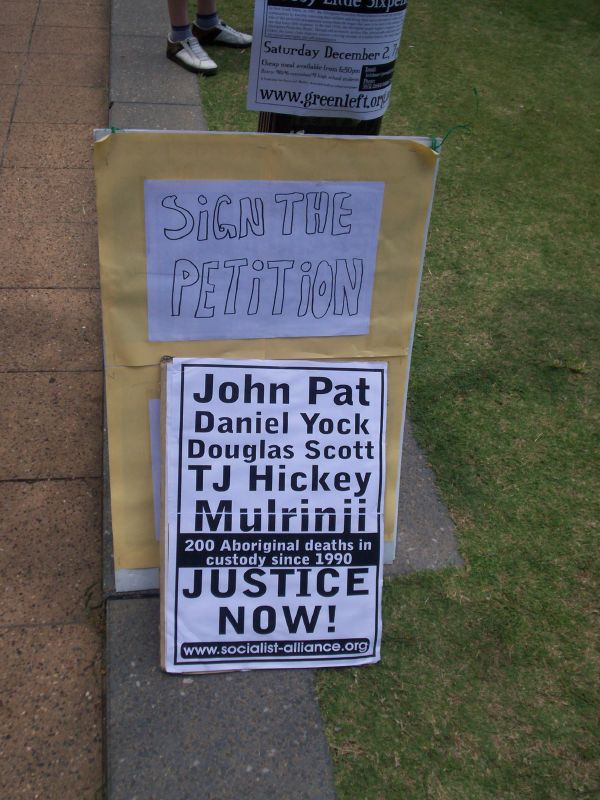 Socialist Alliance - Resistance placard and petition - Justice for Mulrunji Rally at Queens Park and March through Brisbane City, Australia, November 18 2006