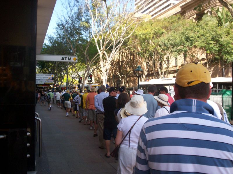 Line up in Adelaide St, Brisbane City, for buses to the Gabba - The Ashes 2006-7 - First Test - Atmosphere in town, outside the Gabba, and watching the game on a big screen at the 'beach' in Southbank.