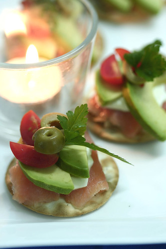 Smoked salmon, avocado, green olives, organic cherry tomato and creme fraiche on Table Water crackers