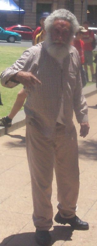 This man was displeased with the badge-sellers, and angrily charged them with 'selling badges on our sorrow' - Justice for Mulrunji Rally at Queens Park and March through Brisbane City, Australia, November 18 2006
