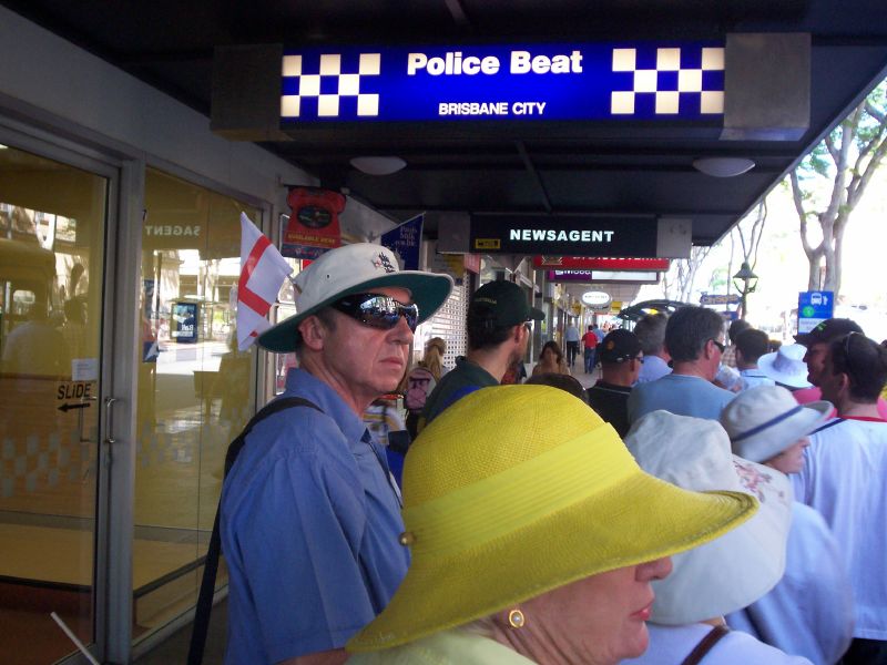 Fans waiting for the bus to the Gabba in Adelaide St, Brisbane City - The Ashes 2006-7 - First Test - Atmosphere in town, outside the Gabba, and watching the game on a big screen at the 'beach' in Southbank.