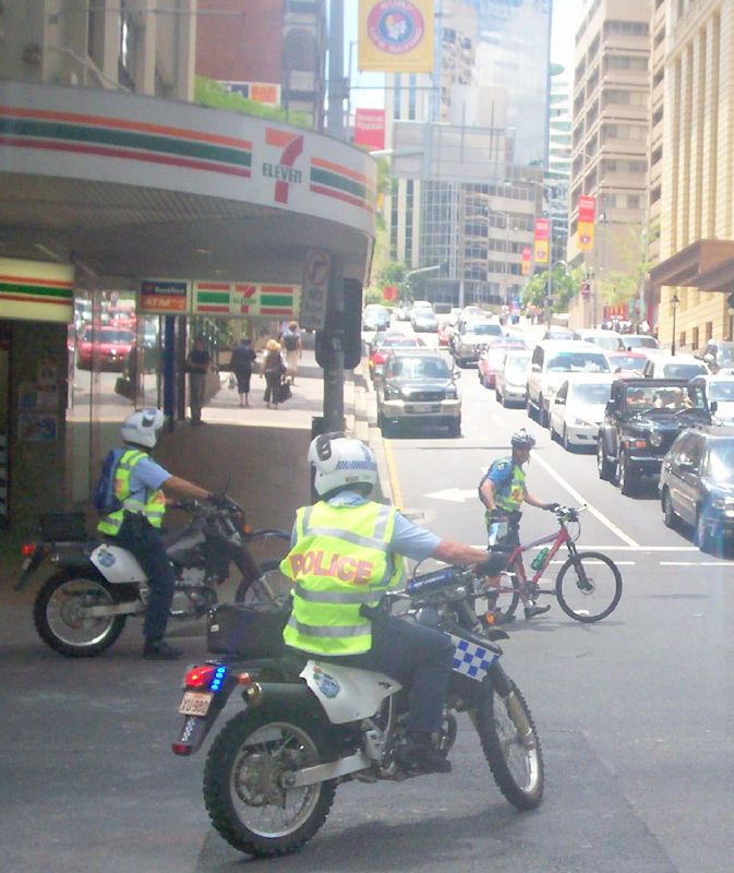 Two Wheeled Police deploy to stop traffic on Edward St entering the Adelaide St intersection - Justice for Mulrunji Rally at Queens Park and March through Brisbane City, Australia, November 18 2006