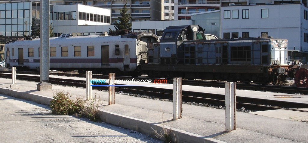 A BB 66000 Diesel locomotive with a catenary maintenance car at the Marseille Saint-Charles station