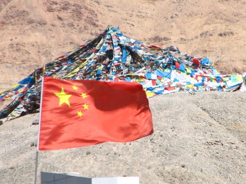 prayer flags hidden by Chinese flag
