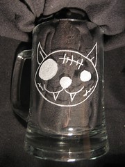 Pirate Cat etched on glass.