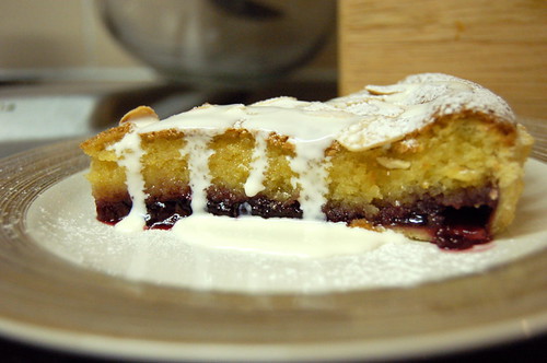 A slice of bakewell tart with cream