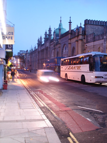 Looking down a dimly lit street towards the Brighton Dome