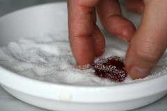 tossing a pomegranate jelly in sugar