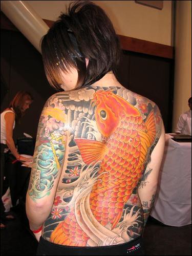 women tattoo. Woman with Koi Tattoo
