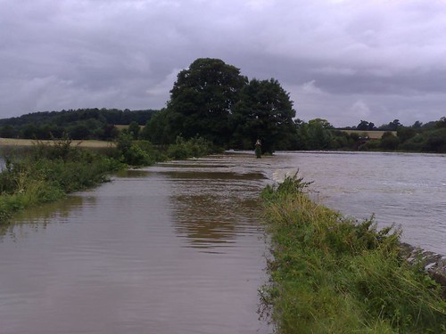 The River rushes over Combe Bridge