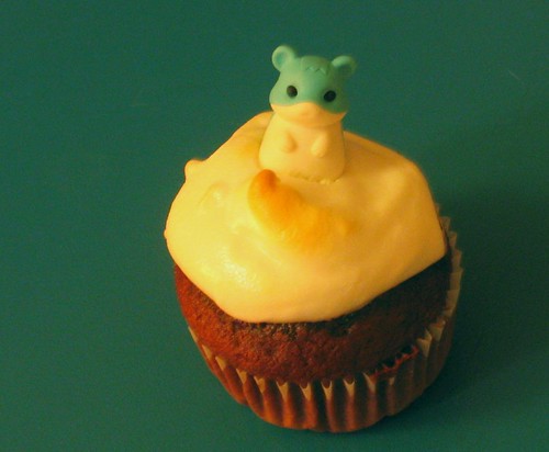 chocolate cupcake with meringue and hamster