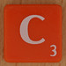 Scrabble white letter on orange C