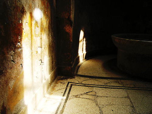 Standing inside a broken Pompeiian bath with camera in my hand.