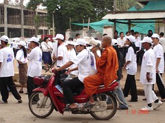 monks doing advocacy and education work in action