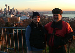 Me and dad at sunset with the seattle skyline behind us including the space needle, mt. rainier, and the sound