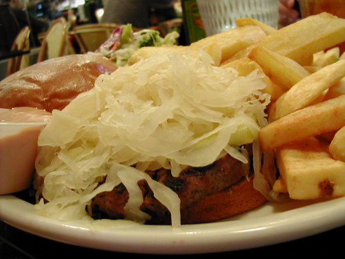 mountain of sauerkraut camouflaging a humongous burger