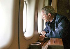 President Bush looks out the window of Air Force One as he flies over New Orleans