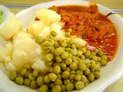 veal stew, potatoes, and peas