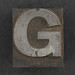 Caslon metal type letter G