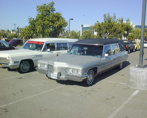 The silver one I'd peg as an early1970s Cadillac while the white one is