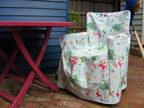 The new chair cover Needs ironing The wind and the rain will have to take 