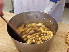 sugar reduction & nuts are briskly stirred to coat nuts