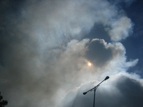 The smoke covers the early afternoon sun
