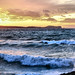 Ibiza - Puesta de sol con olas rompiendo