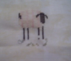 Sheepie on splotchy linen