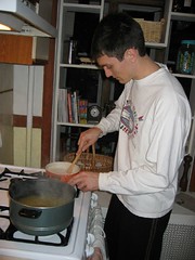 Baker stirring pasta