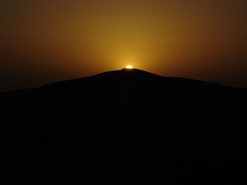 sun eclipsed by dune sand
