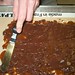 Chocolate Buttercrunch Toffee - spreading out chocolate