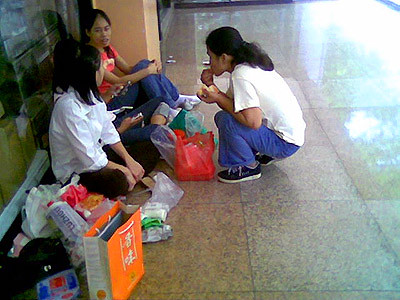 Filipina househelps gather in small corners in Lucky plaza.