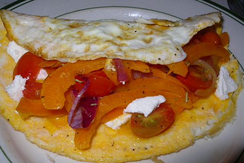 omlette stuffed with goat cheese, grilled onion, orange pepper and cherry tomatoes
