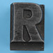 metal type letter R