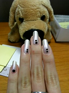 doggy checks out pretty nails