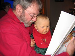 Granddad reading Leda a book