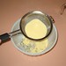 Roquefort and Honey Ice Cream - straining custard over crumbled cheese