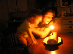 Blowing out candles on Peter's second first birthday cake