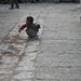boy playing ball in the old town
