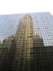The Chrysler Building reflected in the building across the street