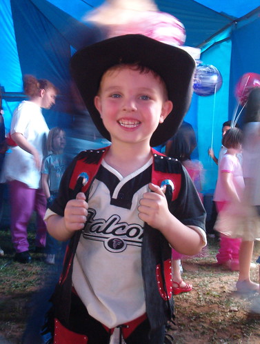cowboy kid happy at the circus