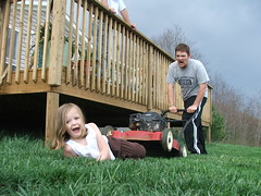 yes, it's my brother trying to run over my dear sweet neice elora with a lawnmower.