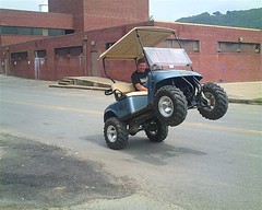 Golf cart popping a wheelie